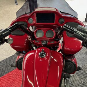 A red motorcycle with a lot of chrome.