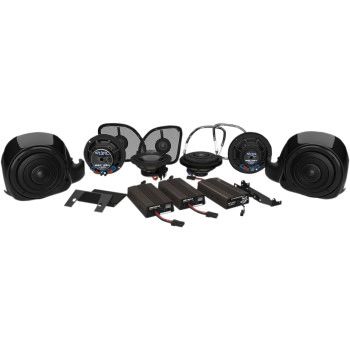 A group of speakers and other accessories sitting on top of a table.