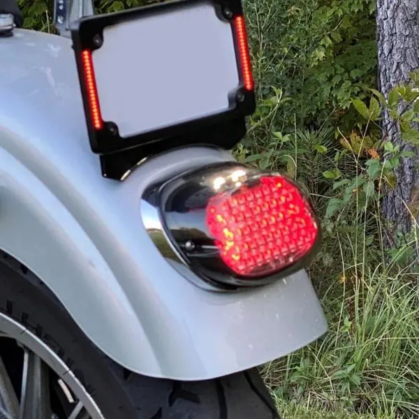 A rear view mirror on the back of a motorcycle.