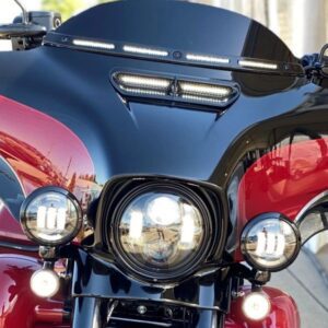 A close up of the headlight on a motorcycle