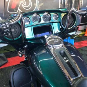 A close up of the instrument panel on a motorcycle.