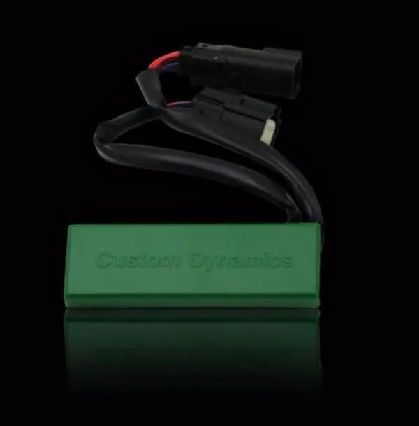 A green box with a black wire and red wire