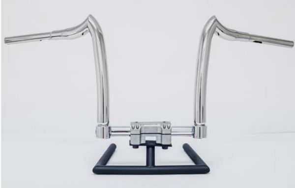 A pair of chrome handlebars on a stand.