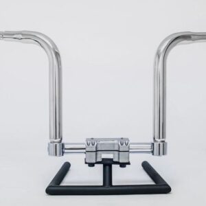 A pair of chrome handlebars on a black stand.