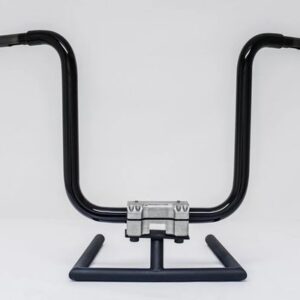 A pair of handlebars sitting on top of a metal stand.