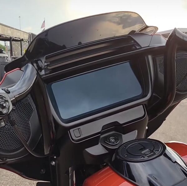 Black motorcycle fairing with a screen.