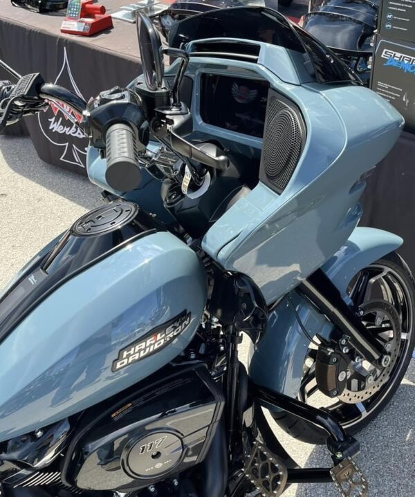 Blue Harley Davidson motorcycle with chrome accents.