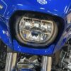 Blue Harley Davidson motorcycle headlight.